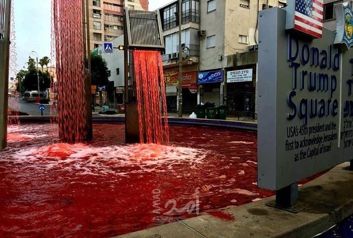 مجهولون يخطون شعار "الضم سيُدفع ثمنه بالدم" على نافورة "ترامب"  في تل أبيب